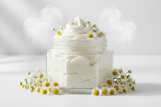 hexagonal glass jar without a lid without label filled with white whipped body butter with delicate white field flowers and puffs of powder