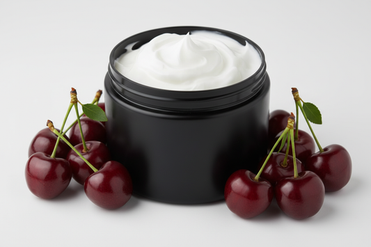 white body butter cream in black plastic jar without label with cherries